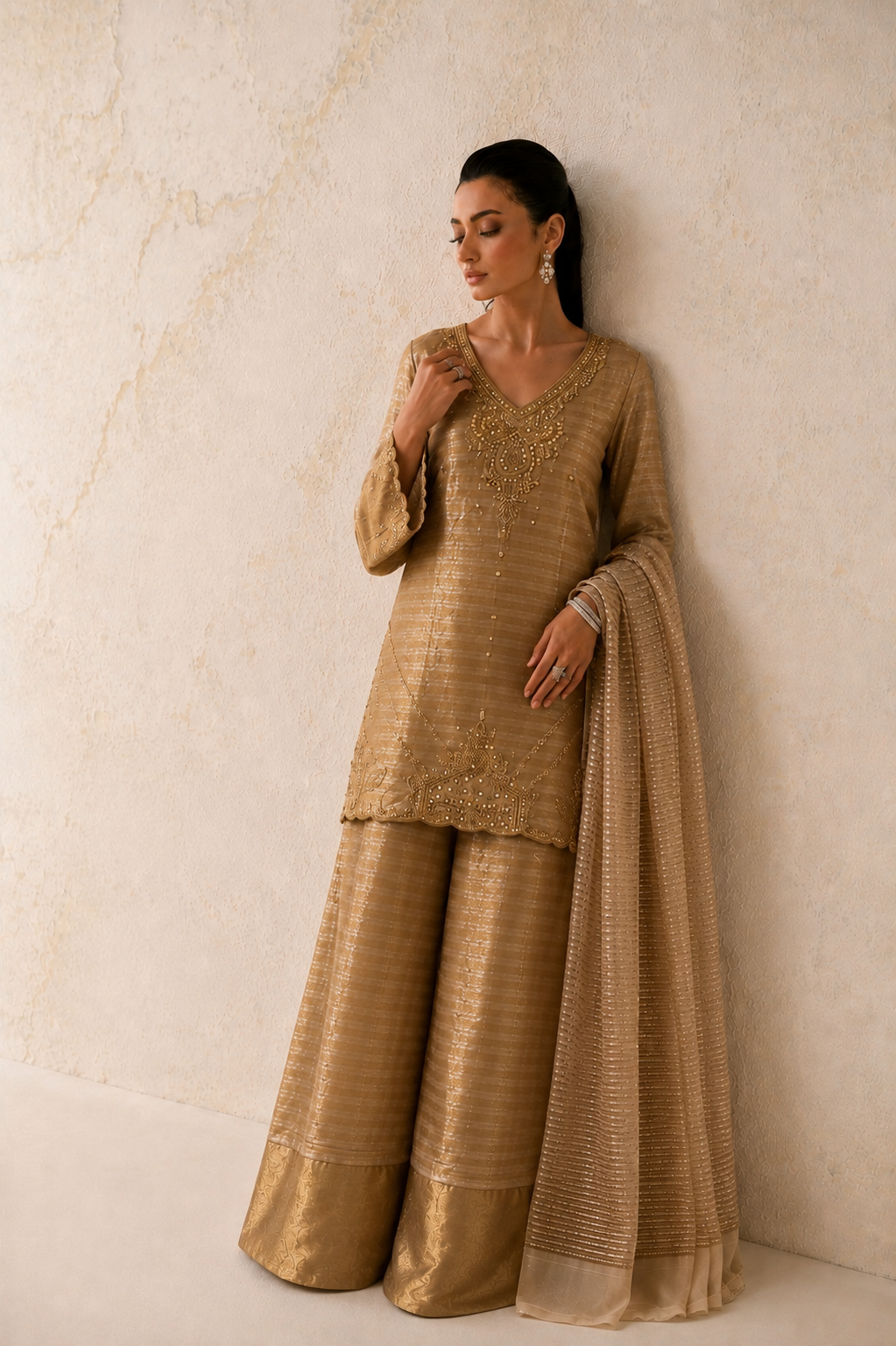 Zarina bronze striped silk suit styled for a Pakistani wedding