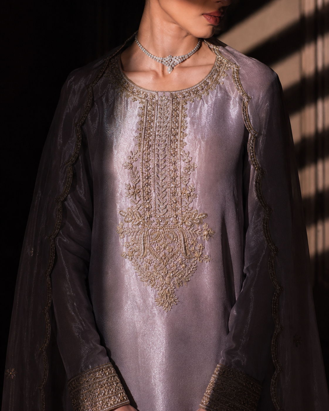 Full-length view of Meher lilac tissue silk kurta set with zardozi hem border and wide-leg trousers