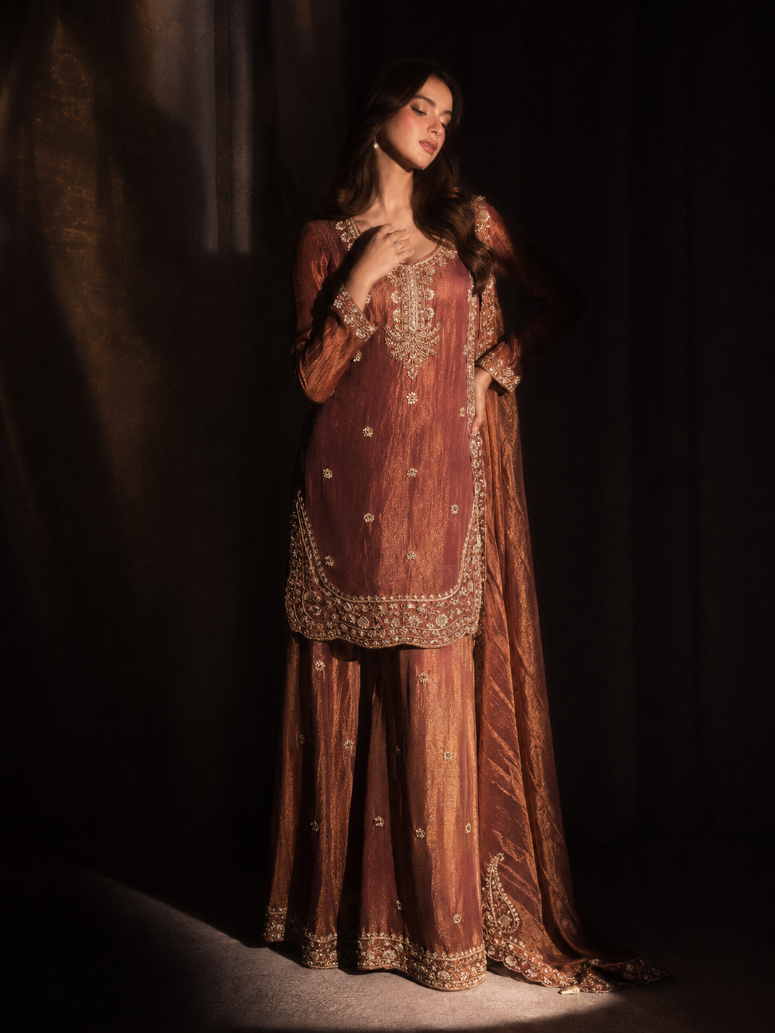 Rust raw silk kameez neckline and tonal thread detailing close-up