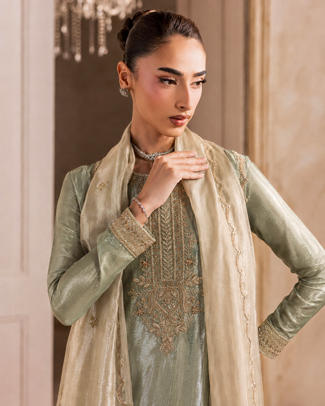Model wearing Aalaya sage green tissue silk kurta with hand embroidered antique gold zardozi neckline, Pakistani formal wear UK
